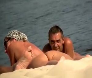 Spycam at naturist beach films bare folks and chick
